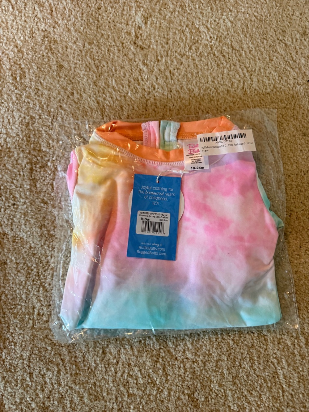 RuffleButts Tie-Dye Pastel rash guard bathing suit - Pink, Blue & Peach